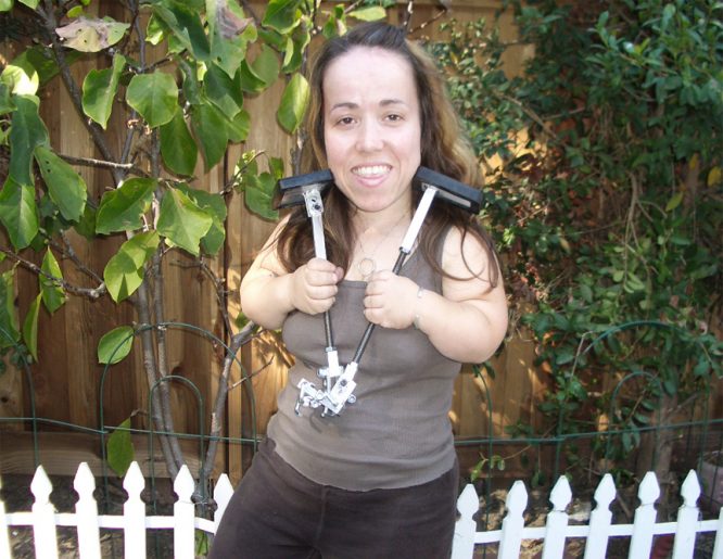 Nico holding her pedal extenders